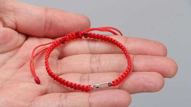Red thread charms attract good luck