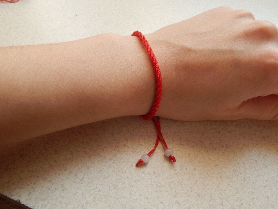red thread on wrist